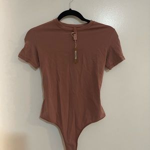 SKIMS short sleeved body suit size M